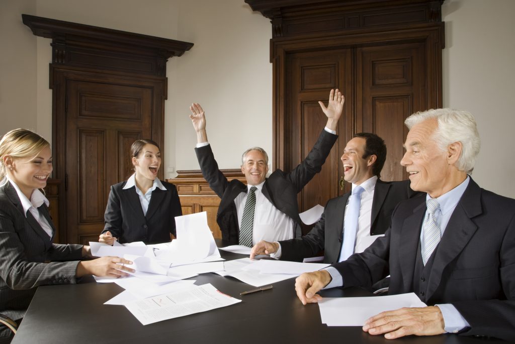 Happy businesspeople in meeting