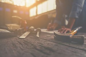 Man working with manual tools on the floor