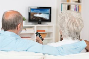 Older couple watching TV