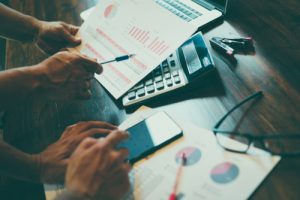 Couple reviewing a mutual fund calculator results