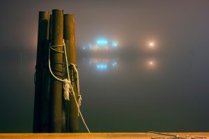 Image of a foggy dock, indicating that Two Harbors is an unsafe investment.