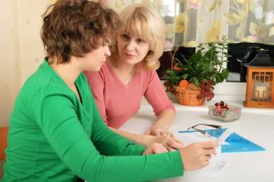 Parent talking with child about finances