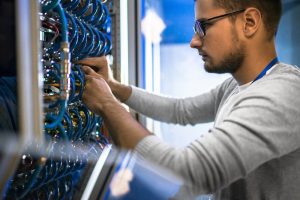 Image of an employee conducting server maintenance