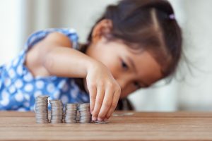 Image of a child counting coins