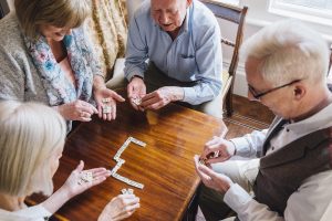 Image of seniors playing dominoes