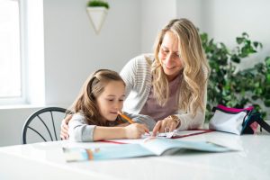 Image of a mother teaching her daughter about compounding