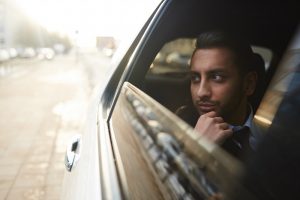 Image of a thoughtful man in a car