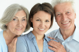 Image of a daughter with her aging parents