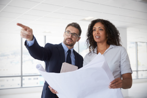 Image of two businesspeople in an empty office