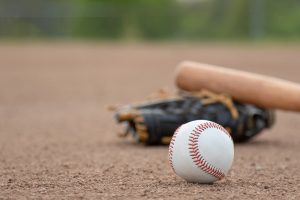 An image of a baseball, mitt, and bat