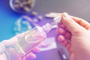 Image of CBD products in a glass bottle in a medical setting