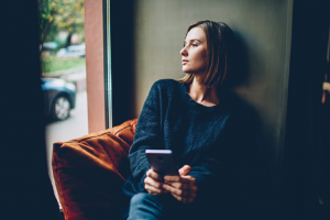 Image of a young woman thinking