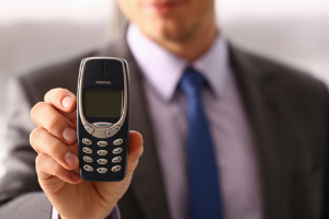 Image of a businessman holding a Nokia phone