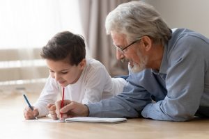 Image of a grandfather teaching his grandson