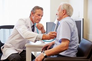 Image of a senior man at a doctor’s appointment