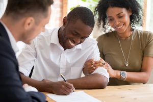 Image of a young couple buying rental real estate