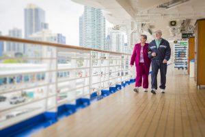 Image of two seniors onboard a cruise ship