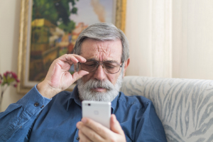 Image of a senior man making an electronic payment