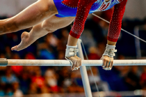 Image of a gymnast on the uneven bars