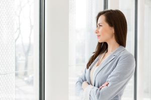 Image of a thoughtful businesswoman considering ESG investing