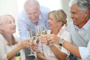 Image of seniors celebrating an investing win with champagne