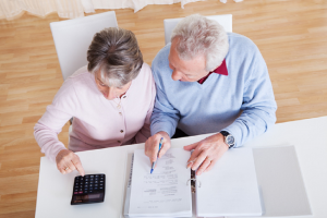 Image of a senior couple working on their retirement planning