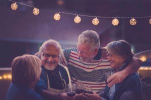 Image of a group of seniors celebrating profits they took using a new trading strategy