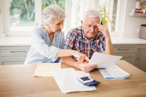 Image of a senior couple managing their finances