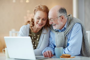 Image of a senior couple using their laptop