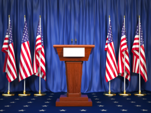 Image of American flags surrounding a podium