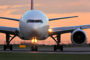 Image of a plane at sunset