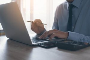 Image of a businessman at his laptop