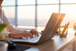 Image of a businesswoman at her computer