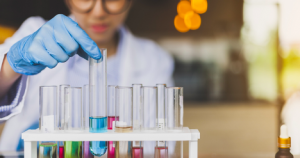 Image of a scientist selecting a test tube