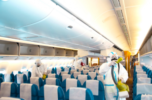 Image of a worker disinfecting an airplane