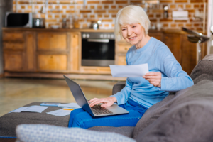 Image of a senior woman saving her stimulus check