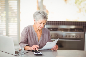 Image of a senior using a calculator