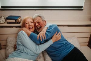 Image of two happy seniors hugging