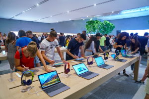 Image of customers trying out technology in an Apple store