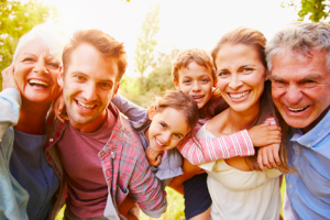 Image of a happy senior couple with their family