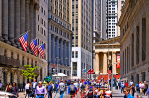 Colorful, happy image of a crowd walking on Wall Street