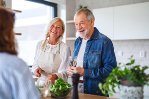 Image of a senior couple preparing a salad