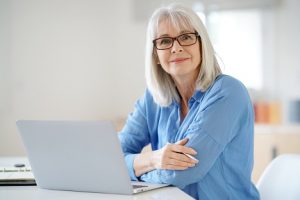 Image of a senior businesswoman working in her office