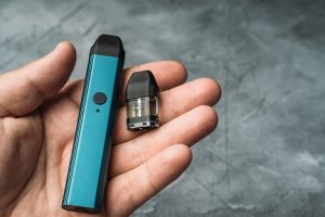 Image of a hand holding a vape pen