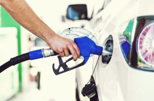 Image of a man pumping gas