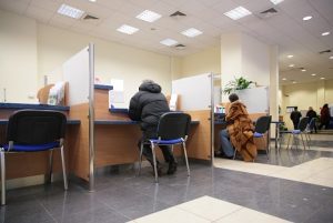 Image of customers seated inside a bank