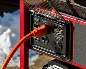 Image of a portable power generator sitting in the snow