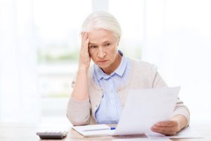 Image of a senior woman doing taxes