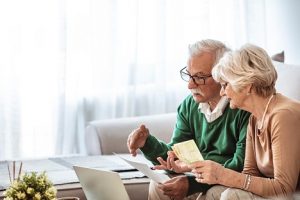 Image of a senior couple managing their finances