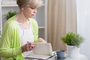 Image of a senior woman checking her calendar